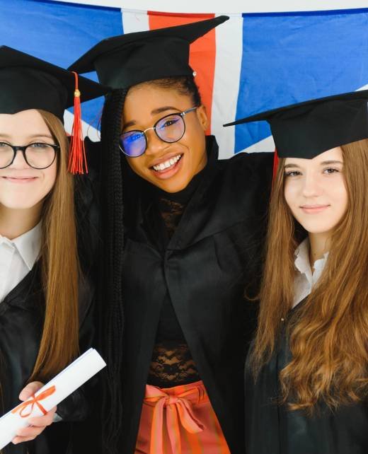 portrait of multiracial graduates holding diploma